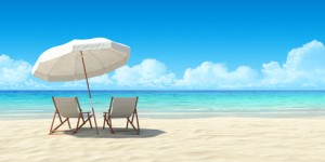 Beach chair and umbrella on sand beach. Concept for rest, relaxation, holidays, spa, resort.